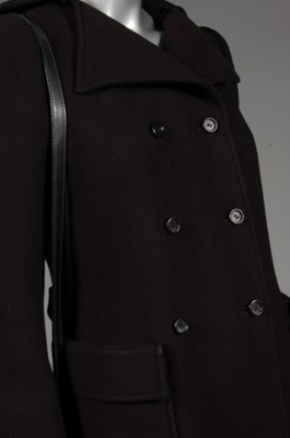 Lot 175 - A Courrges black wool coat and handbag,...