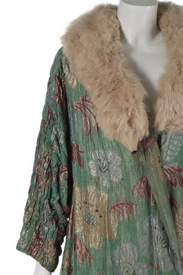 Lot 115 - A lamé opera coat, early 1930s, the pale green...