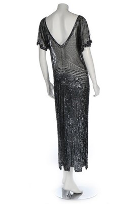 Lot 122 - A black beaded and sequinned tulle evening...