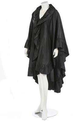 Lot 60 - An Yves Saint Laurent black taffeta cape,...