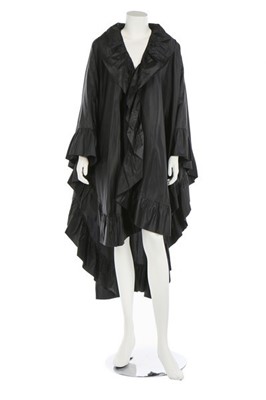Lot 60 - An Yves Saint Laurent black taffeta cape,...
