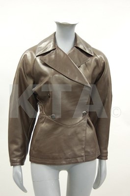 Lot 115 - An Aladouble-breasted brown leather jacket,...