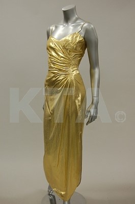 Lot 188 - A Loris Azzaro cloth of gold evening gown,...