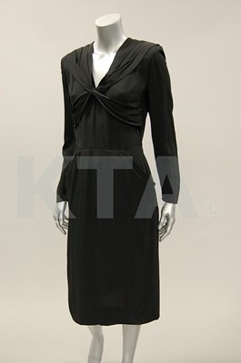 Lot 194 - A Paquin black crepe dinner gown, early 1950s,...