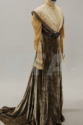 Lot 202 - A mushroom velvet and lace gown, circa 1910,...