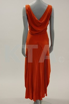 Lot 207 - A brick red crepe de chine evening gown, circa...