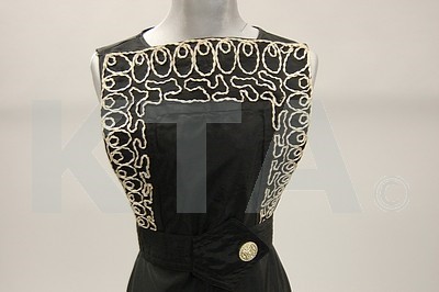 Lot 252 - Two early 1940s dresses, one of black wool...