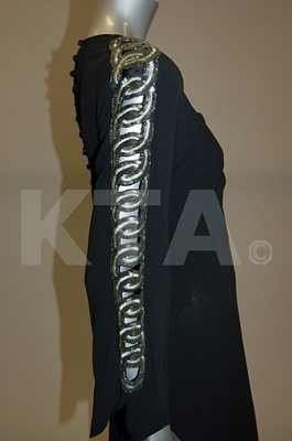 Lot 252 - Two early 1940s dresses, one of black wool...