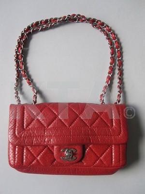 Lot 289 - A Chanel red quilted leather bag, modern, the...