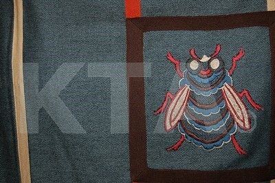 Lot 326 - A Bill Gibb poncho with embroidered bee motif,...