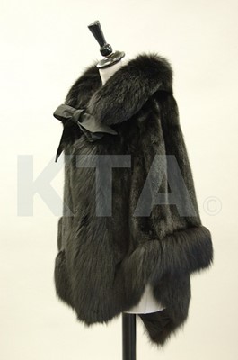 Lot 344 - A black mink and fox fur cape, 1970s, lined in...