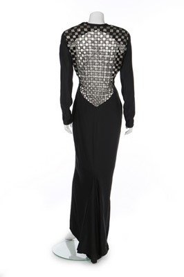 Lot 165 - A Gianni Versace black silk evening dress with...