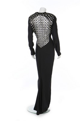 Lot 165 - A Gianni Versace black silk evening dress with...
