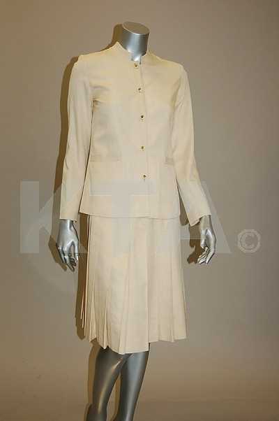 Lot 39 - A Chanel boutique cream silk suit, 1970s,...
