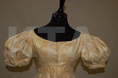 Lot 92 - An oyster taffeta gown, mid 1820s, together...
