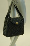 Lot 4 - A Chanel navy quilted leather handbag, modern,...