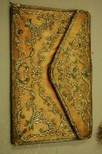 Lot 12 - An embroidered pink satin wallet, circa 1780,...