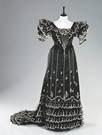 Lot 36 - A striking black satin and tamboured tulle...