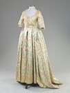 Lot 26 - An open robe of Chinese inspired brocaded...