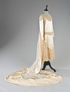 Lot 47 - A couture ivory satin bridal gown, circa 1928,...