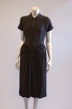 Lot 68 - A Balenciaga couture black crepe dinner dress,...