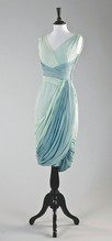 Lot 72 - A Jean Desss draped chiffon cocktail gown,...
