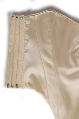 Lot 182 - A rare John Galliano ivory satin corset-bodice,...