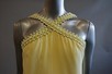 Lot 128 - An Yves Saint Laurent boutique pale yellow...
