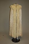 Lot 68 - A damask satin opera cape, circa 1890, lined...