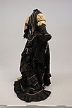 Lot 158 - A black voided velvet and taffeta evening gown,...