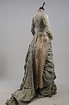 Lot 160 - A dove grey silk evening gown, circa 1885-90,...