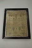 Lot 185 - An embroidered sampler by Caroline Philllis...