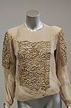 Lot 194 - A group of blouses and lace evening jackets,...