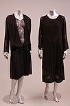 Lot 238 - A group of mainly black dinner gowns and coats,...