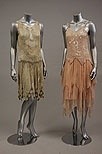 Lot 242 - Two beaded dresses, one of pale green muslin...