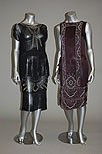 Lot 243 - Three black beaded dresses, 1920s, all with...
