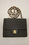Lot 336 - A Chanel evening bag, probably 1990s, of black...