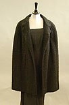 Lot 165 - A Balenciaga black bouclwool cape, late 50s or...