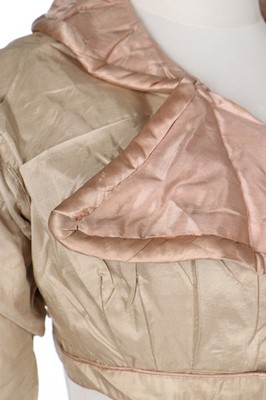 Lot 29 - A rare beige and pink silk spencer, 1810-20,...