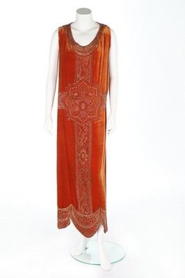 Lot 57 - An embroidered brick-red velvet couture...