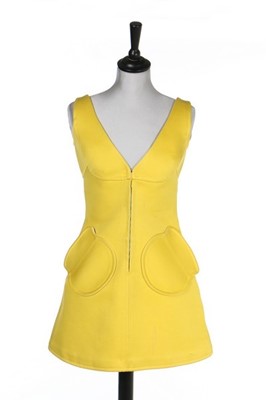 Lot 103 - An André Courrges yellow mini-dress,...