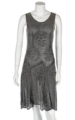 Lot 191 - A beaded black muslin flapper dress, circa...