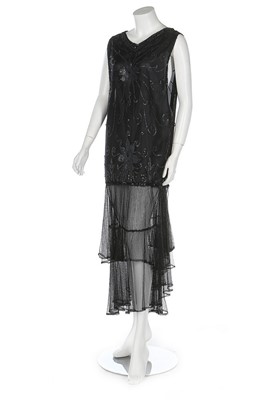 Lot 195 - A sequinned black tulle evening dress, 1920s,...