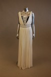 Lot 104 - An ivory silk tulle evening gown, V-neckline,...