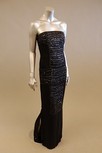 Lot 109 - A black silk strapless evening gown, with...