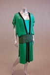Lot 111 - An emerald georgette tunic dress with large...