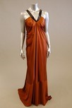 Lot 117 - A bronze satin full-length evening gown, with...