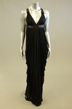 Lot 128 - A black jersey empire-line evening gown, with...