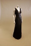 Lot 146 - A black and grey georgette evening gown, with...