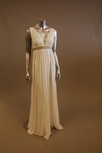 Lot 153 - A white jersey empire-line evening gown, with...